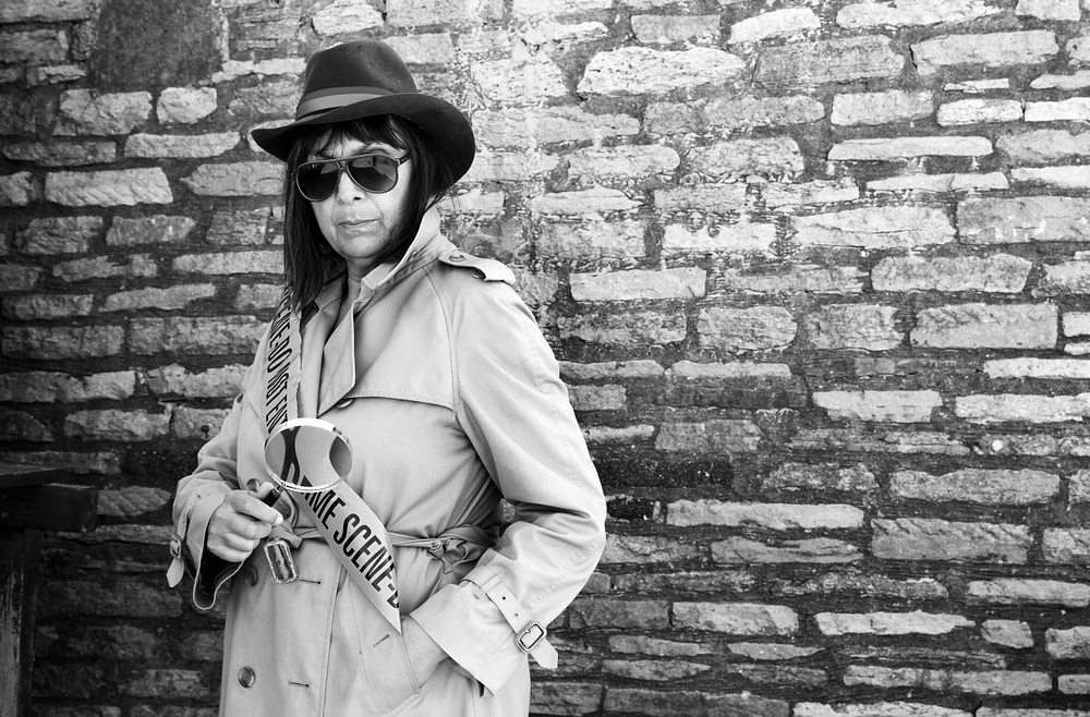 Trisha as Investigator Lewis Black and White